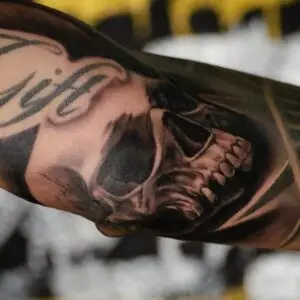Fresh tattoo healing on a forearm