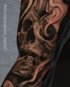 Tattoo artist working on a detailed custom tattoo in a clean Boynton Beach studio