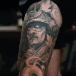 Black and grey samurai realism tattoo sleeve by All City Tattoo