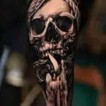 Dark smoking skull blackwork tattoo by All City Tattoo