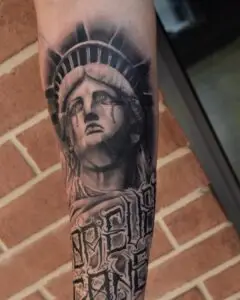 Statue of Liberty black and grey realism tattoo by All City Tattoo