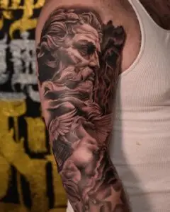 Black and grey realism Zeus tattoo by All City Tattoo
